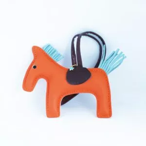 horse charm orange